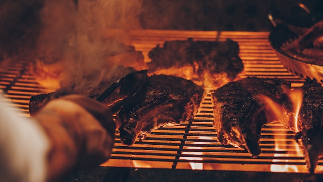 Outdoor string lights BBQ setup warm